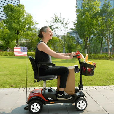 Metro Mobility Max Sport Portable 4-Wheel Mobility Scooter Red Woman on Sidewalk Coming from Grocery Store