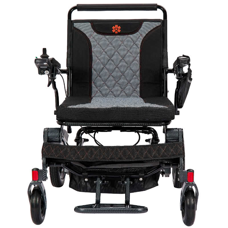 Black and gray electric wheelchair with quilted seat on a white background