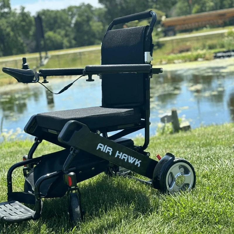 Air Hawk Power Wheelchair on the Grass, left side view
