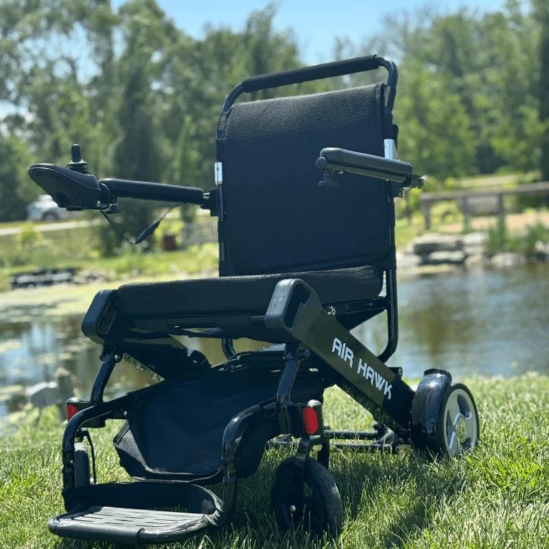 Air Hawk Foldable Power Wheelchair on the Grass, Left side view